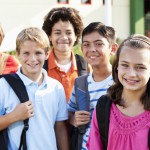 girl-standing-outside-school-with-group-of-friends-184379184-57ceaca25f9b5829f4d52c5f